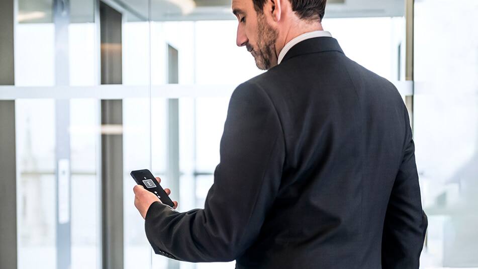 Summoning an elevator with your phone helps to avoid the need to touch surfaces. 